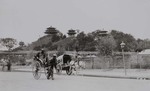 Rickshaw and a horse-drawn cart in Beijing