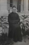 Fr. Charles Meeus Sitting by the stairs of the bishop's residence