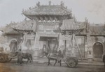 Horse drawn carts in front of the Temple of the God of Medicine