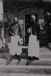 Fr. Vincent Bai and Fr. Paul Gilson on the stairs of the rectory