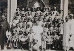 Fr. Vincent Bai and the school children of the parish