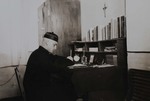 Fr. Paul Gilson at his desk 2