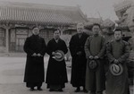 Fr. Paul Gilson and three Chinese students in the courtyard of the Apostolic delegation
