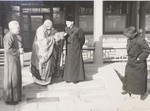 Fr. Raymond de Jaegher with a Lama dress belonging to Mgr. Joseph Comisso 1