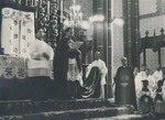 Archbishop Antionio Riberi in the Beitang Cathedral reading the papal bull establishing the Chinese Church 1