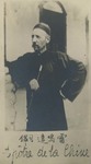 Fr. Vincent Lebbe in Chinese garb and holding a long pipe