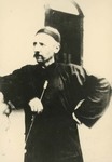 Fr. Vincent Lebbe holding a long Chinese pipe